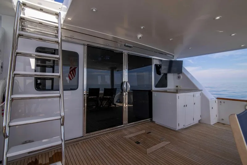 Slide: The Image of Luxurious 2001 Hargrave 94 yacht deck with sleek design and ocean view. - 47