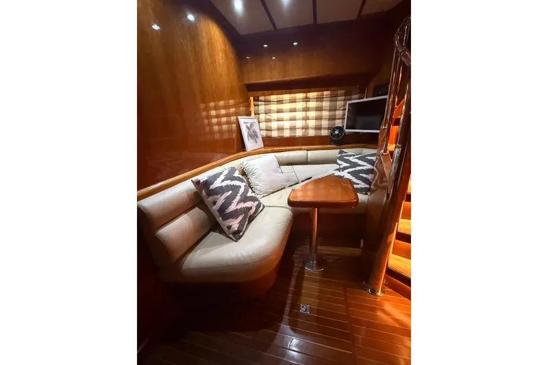 Slide: The Image of Luxurious interior of 2001 Hargrave 94 yacht with plush seating and elegant wood finishes. - 51