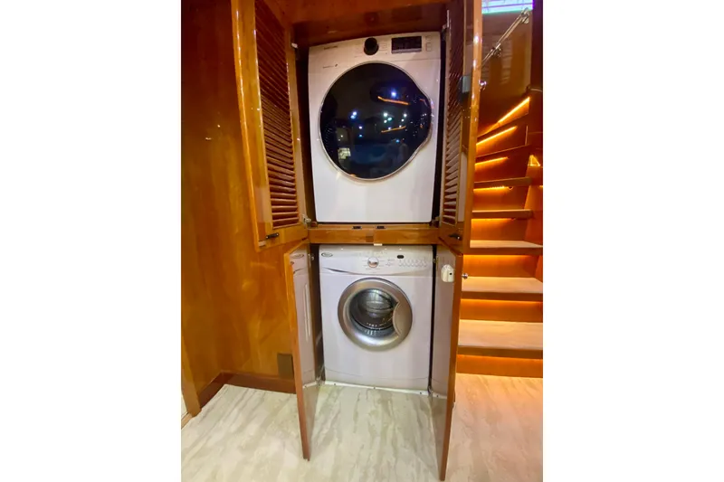 Slide: The Image of Stacked washer and dryer in wooden cabinet aboard 2001 Hargrave 94 yacht. - 53