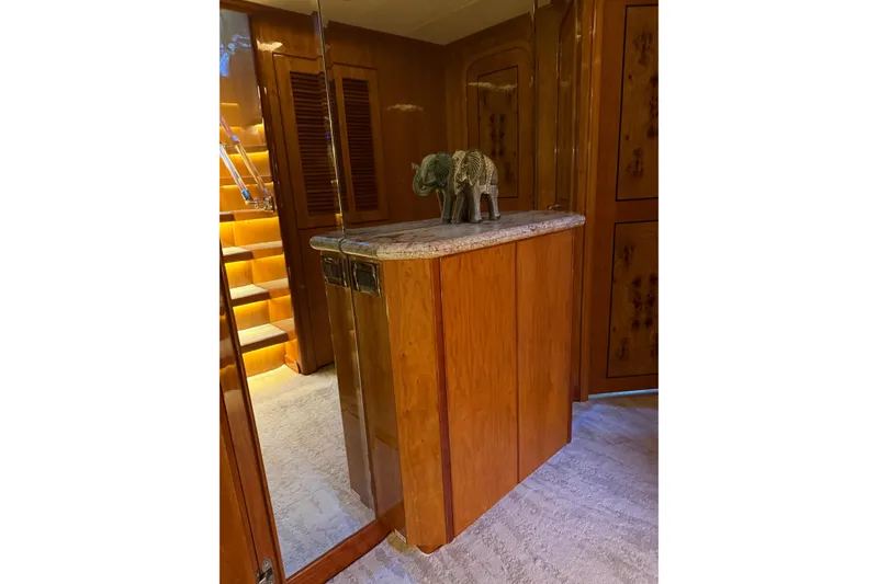 Slide: The Image of Luxurious wooden interior of 2001 Hargrave 94 yacht with decorative elephant statue. - 54
