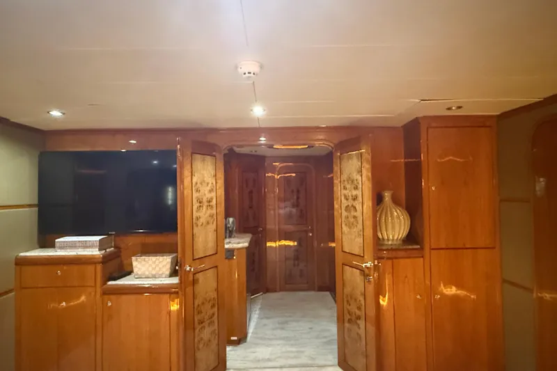 Slide: The Image of Luxurious interior of a 2001 Hargrave 94 yacht with elegant wood paneling and decor. - 58