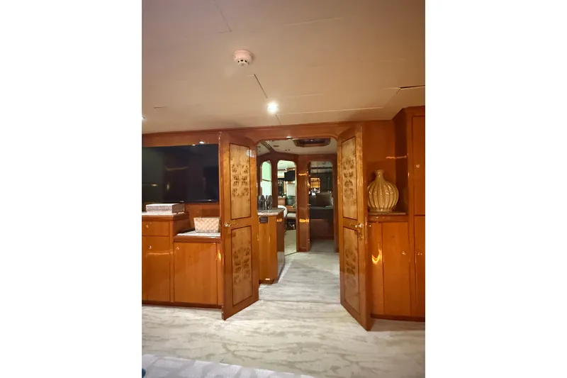 Slide: The Image of Luxurious interior of a 2001 Hargrave 94 yacht with elegant wood finishes. - 59