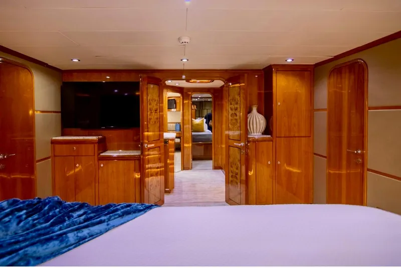Slide: The Image of Luxurious interior of 2001 Hargrave 94 yacht with elegant wood paneling and modern amenities. - 60