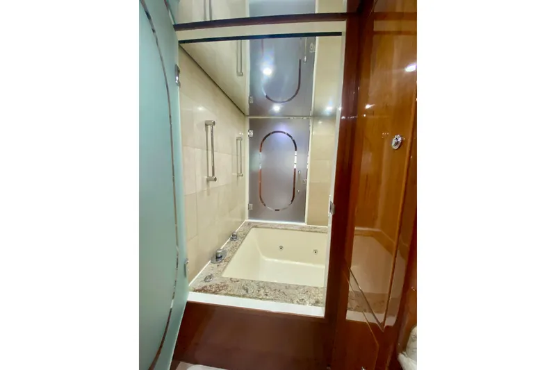 Slide: The Image of Luxurious bathroom with a marble tub in a 2001 Hargrave 94 yacht. - 68