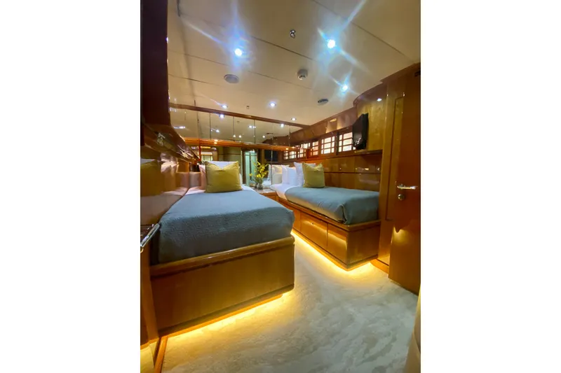 Slide: The Image of Luxurious cabin interior of 2001 Hargrave 94 yacht with twin beds and ambient lighting. - 71
