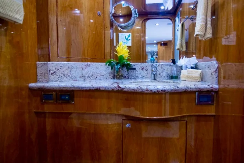 Slide: The Image of Luxurious bathroom interior on 2001 Hargrave 94 yacht with marble countertop and wooden cabinetry. - 75