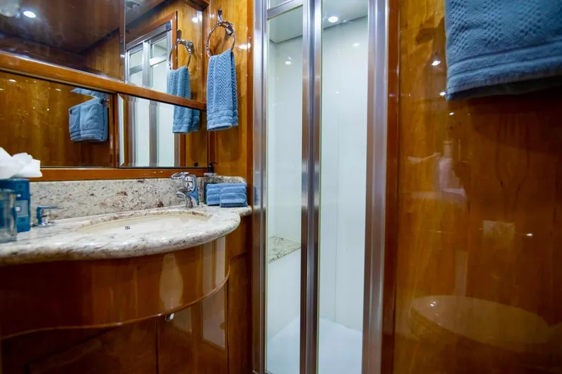 Slide: The Image of Luxurious bathroom in 2001 Hargrave 94 yacht with wood finish and marble countertop. - 77