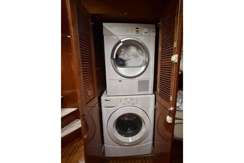 Slide: The Image of Stacked washer and dryer in wooden cabinet on Hargrave 94 yacht, 2001 model. - 88