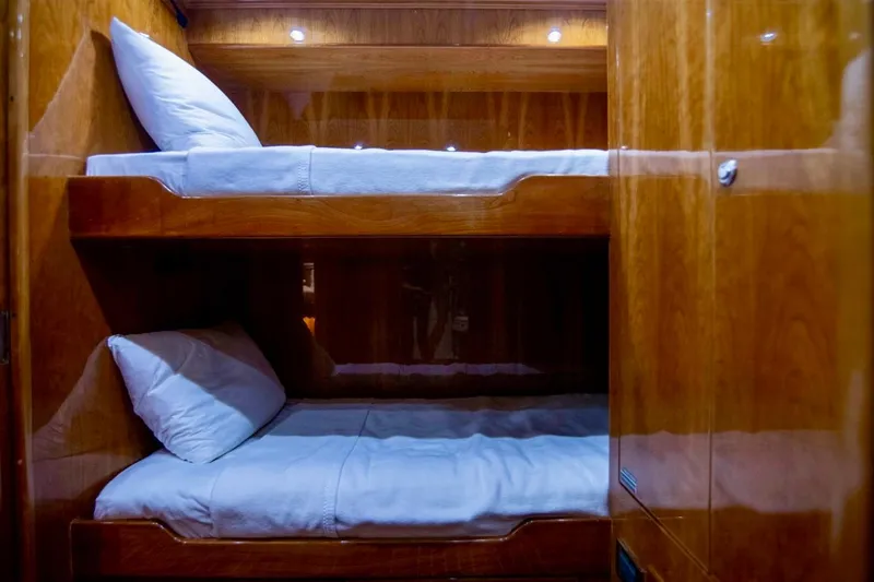 Slide: The Image of Bunk beds in luxurious wooden cabin interior of 2001 Hargrave 94 yacht. - 93