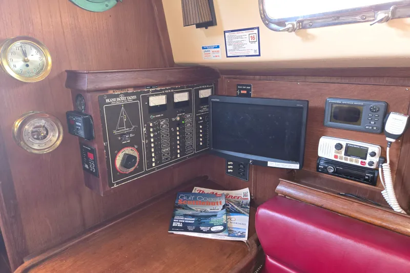 Slide: The Image of Navigation and control panel of a 1989 Island Packet 35 yacht interior. - 33
