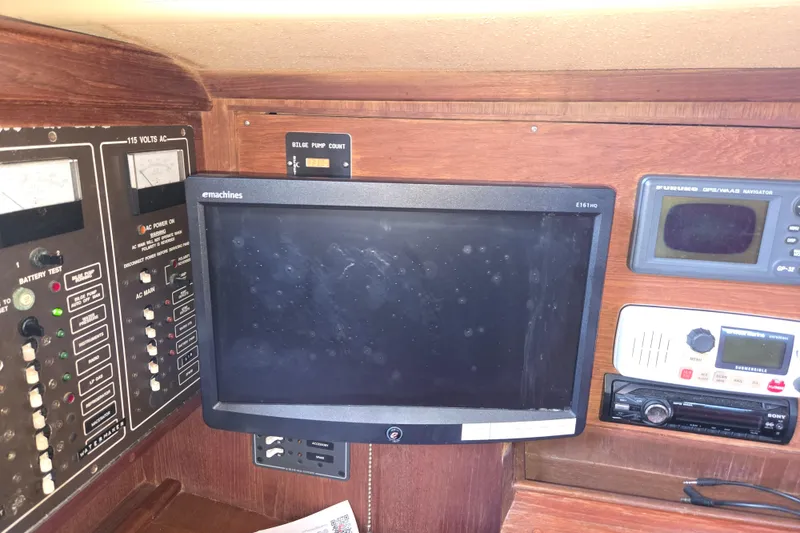 Slide: The Image of Navigation and control panel of a 1989 Island Packet 35 sailboat. - 34