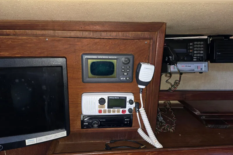 Slide: The Image of Navigation and communication equipment on a 1989 Island Packet 35 sailboat. - 36