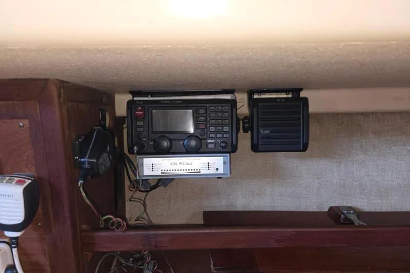 Slide: The Image of Radio equipment inside a 1989 Island Packet 35 sailboat cabin. - 38
