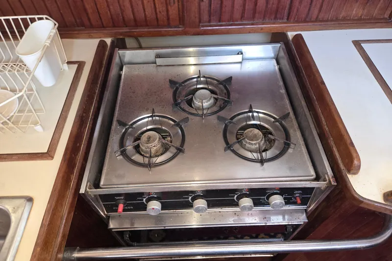 Slide: The Image of Three-burner stove in 1989 Island Packet 35 yacht kitchen. - 45