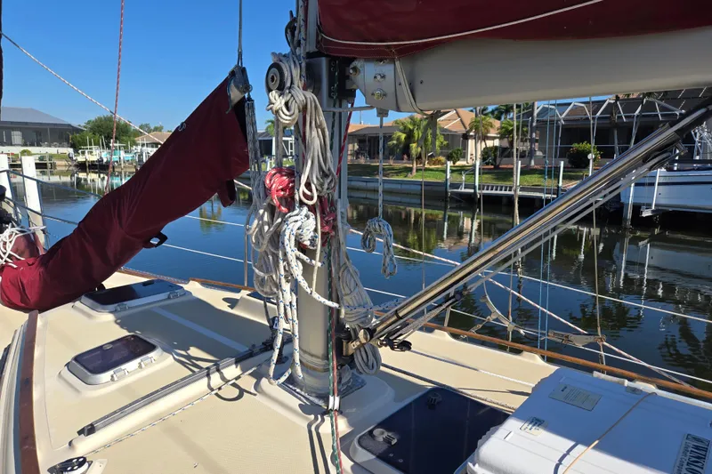 Slide: The Image of 1989 Island Packet 35 sailboat deck with rigging and marina view. - 55