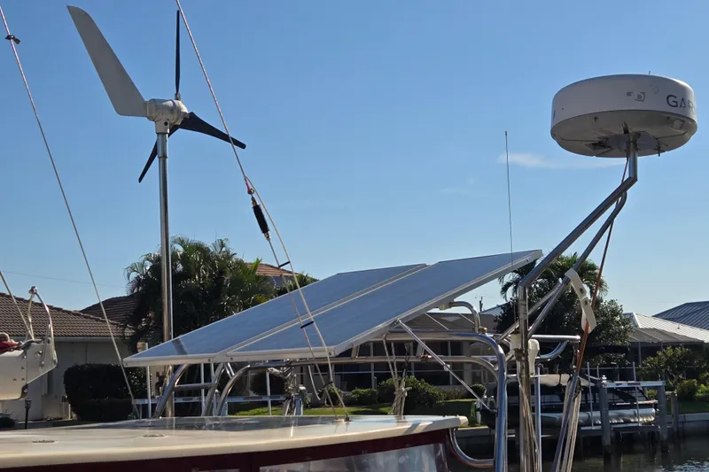 Slide: The Image of Sailboat with solar panels and wind turbine, Island Packet 35, 1989 model. - 66