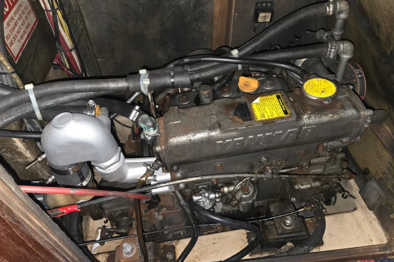 Slide: The Image of Engine of a 1989 Island Packet 35 sailboat, featuring Yanmar components. - 77