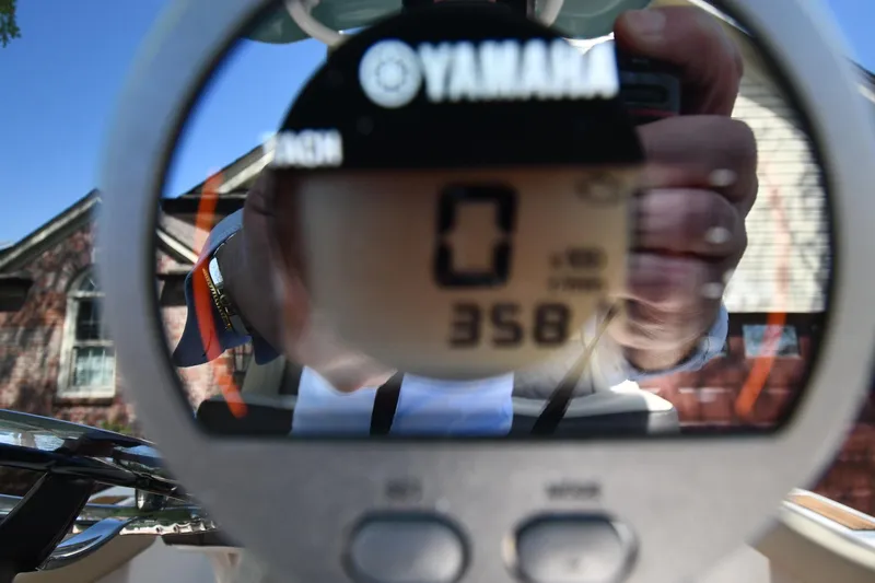 Slide: The Image of Close-up of Yamaha boat gauge on 2021 Tidewater 210 CC Adventure, displaying 358 hours. - 14