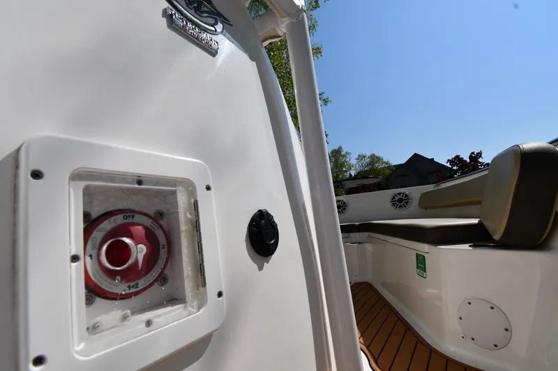 Slide: The Image of 2021 Tidewater 210 CC Adventure boat interior with seating and control panel. - 24