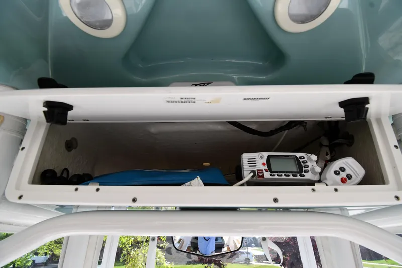 Slide: The Image of Storage compartment in a 2021 Tidewater 210 CC Adventure boat with electronic equipment. - 27