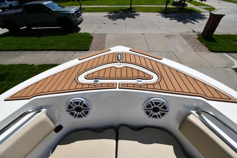 Slide: The Image of 2021 Tidewater 210 CC Adventure boat bow with teak deck and speakers. - 8