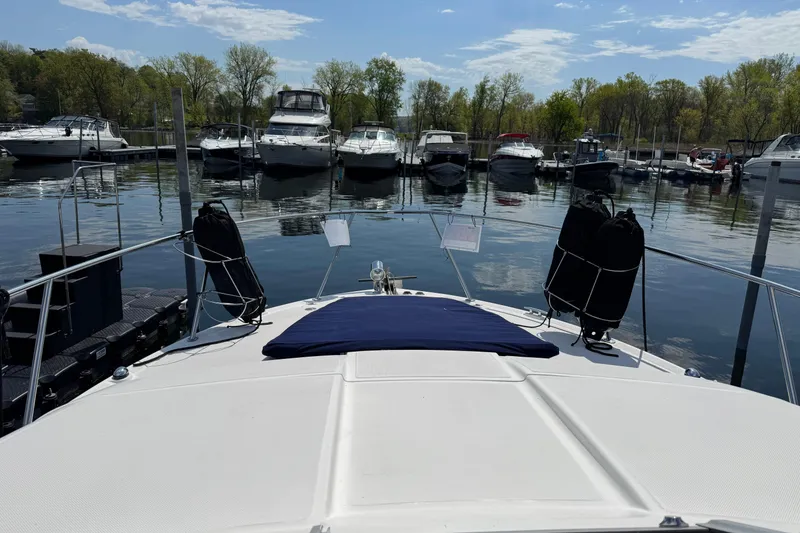 Slide: The Image of 2007 Regal 3060 Window Express docked at a marina with other boats. - 10