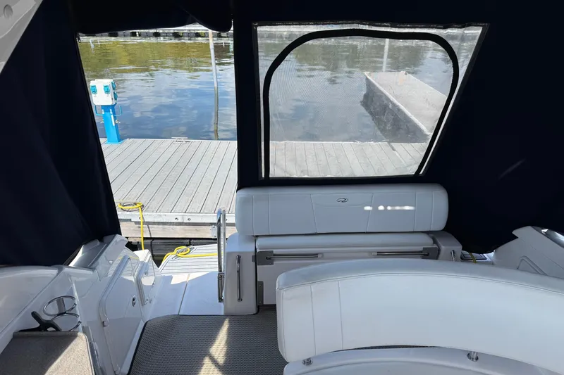 Slide: The Image of 2007 Regal 3060 Window Express boat interior with dock view through rear window. - 15
