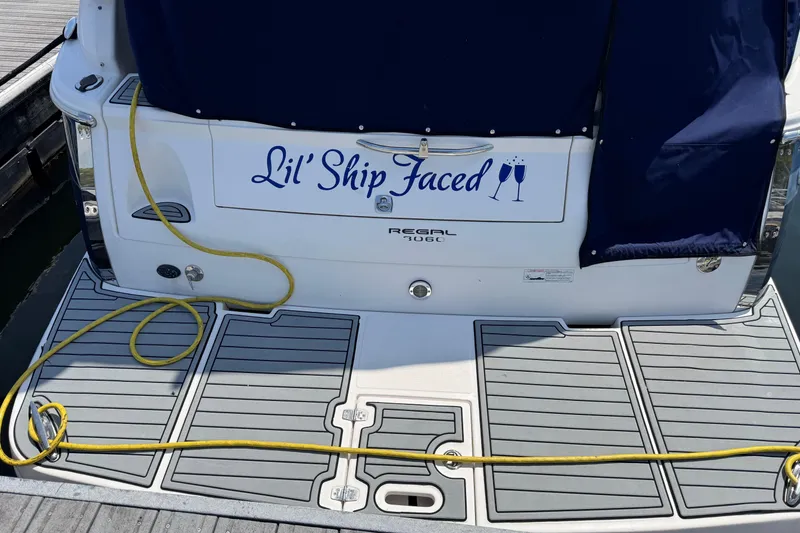 Slide: The Image of 2007 Regal 3060 Window Express boat with "Lil' Ship Faced" nameplate at dock. - 30
