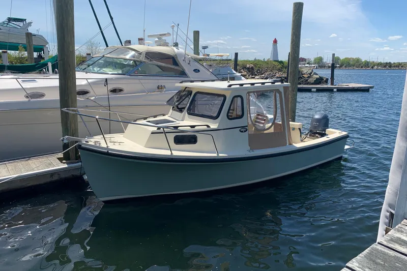 The Image of 2020 Eastern 22 Sisu Hardtop boat docked in a marina. - 0