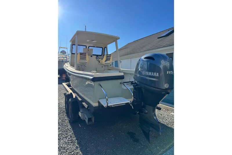 Slide: The Image of 2020 Eastern 22 Sisu Hardtop boat with Yamaha 115 engine on trailer. - 2