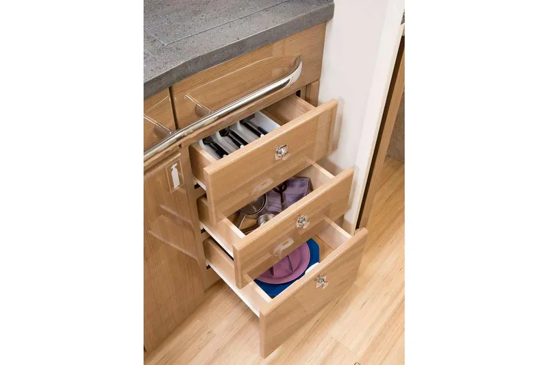 Slide: The Image of Manufacturer Provided Image: Open wooden drawers in the kitchen of a 2016 Formula 37 Cruiser. - 15