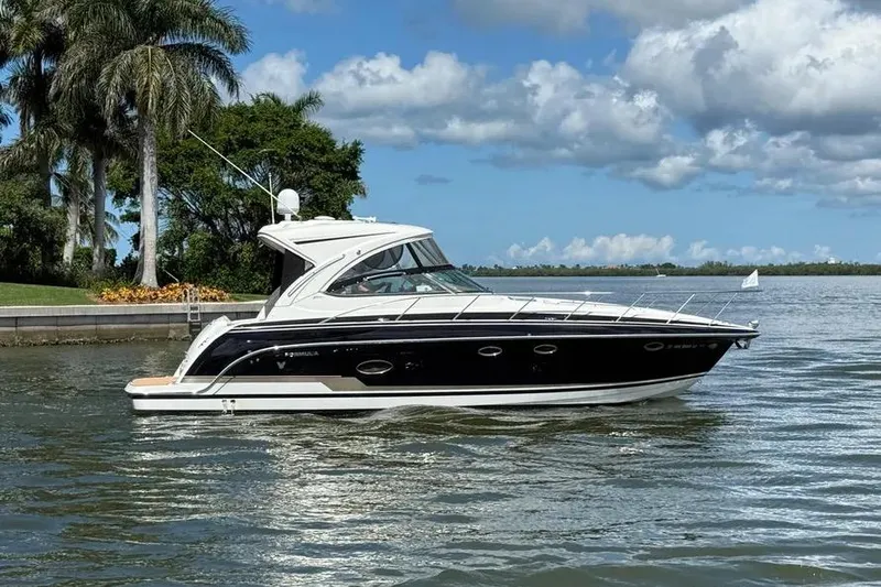 Slide: The Image of 2016 Formula 37 Performance Cruiser on a scenic waterway with palm trees. - 17