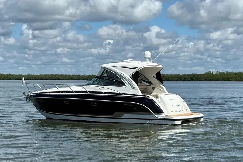 Slide: The Image of 2016 Formula 37 Performance Cruiser on calm water under cloudy sky. - 18