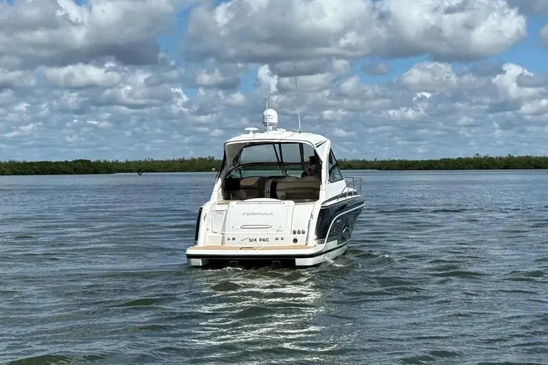 Slide: The Image of 2016 Formula 37 Performance Cruiser on calm water under cloudy sky. - 19
