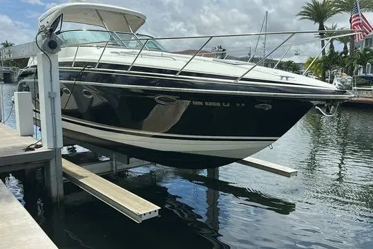 Slide: The Image of 2016 Formula 37 Performance Cruiser docked on a lift in a marina. - 22