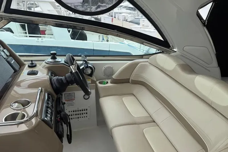 Slide: The Image of 2016 Formula 37 Performance Cruiser interior with beige seating and modern helm controls. - 23