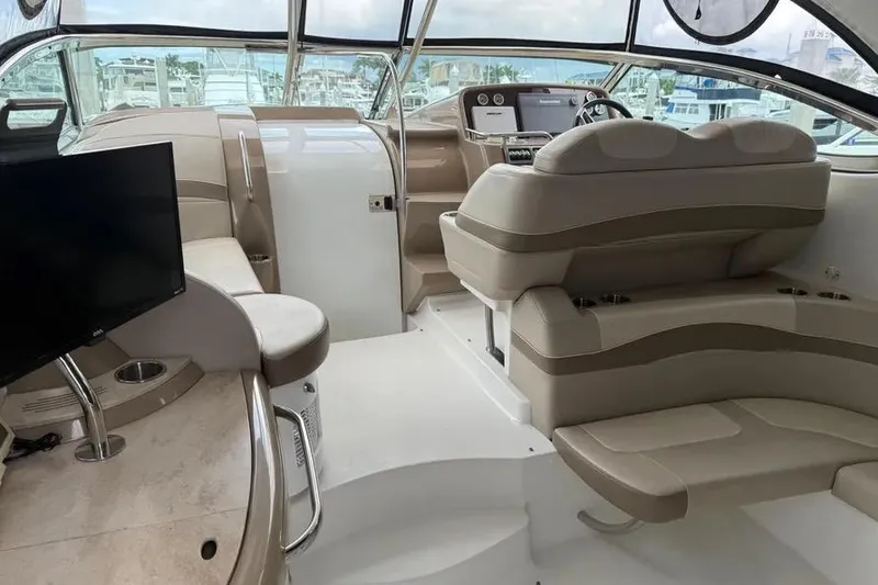 Slide: The Image of Interior of a 2016 Formula 37 Performance Cruiser with beige seating and a mounted TV. - 25