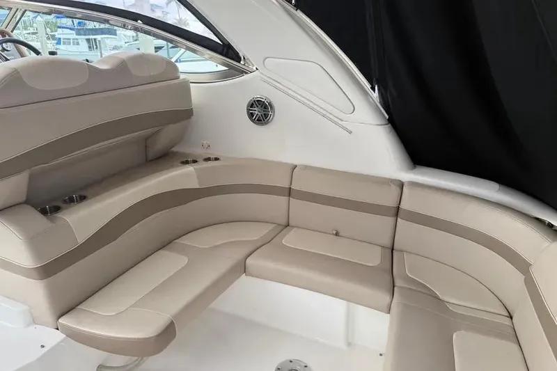 Slide: The Image of Interior seating of 2016 Formula 37 Performance Cruiser, featuring beige upholstery and cup holders. - 26