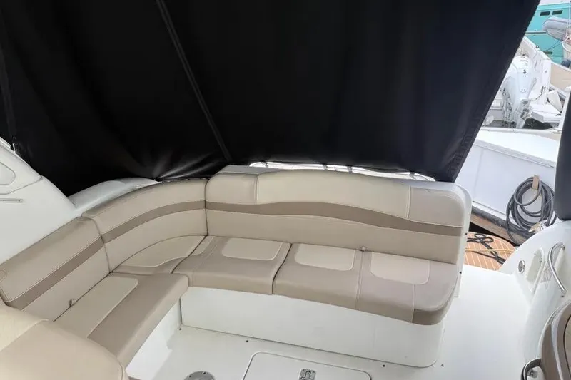 Slide: The Image of 2016 Formula 37 Performance Cruiser interior with beige seating and black canopy. - 27