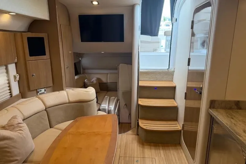 Slide: The Image of Interior of a 2016 Formula 37 Performance Cruiser with elegant seating and wooden accents. - 28