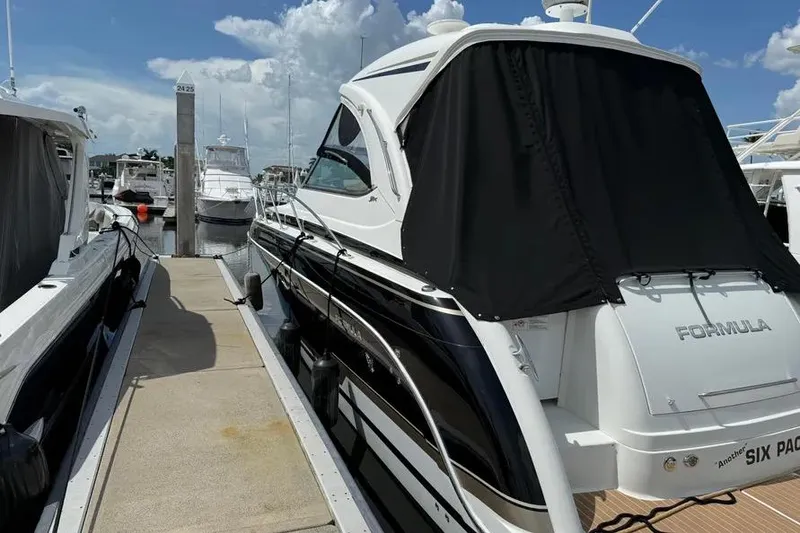 Slide: The Image of 2016 Formula 37 Performance Cruiser docked at marina under clear skies. - 36