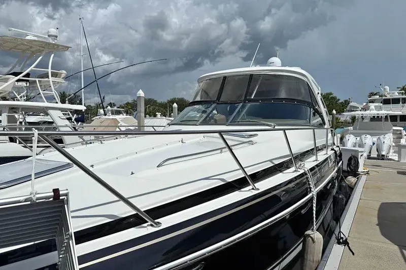 Slide: The Image of 2016 Formula 37 Performance Cruiser docked at marina under cloudy sky. - 38