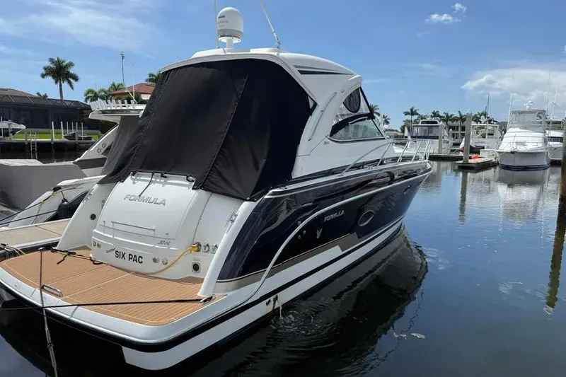 Slide: The Image of 2016 Formula 37 Performance Cruiser docked at marina under clear sky. - 39