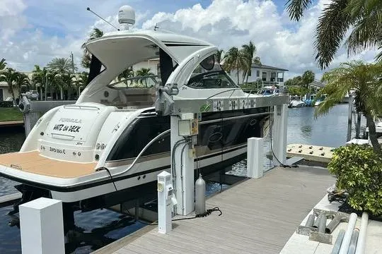 Slide: The Image of 2016 Formula 37 Performance Cruiser docked at a marina with palm trees. - 40