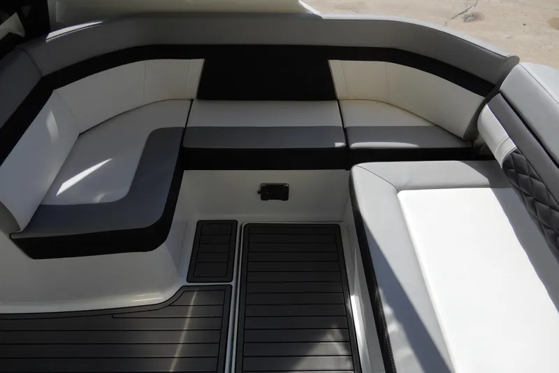 Slide: The Image of 2022 Monterey 295 Sport Yacht interior seating with sleek, modern design and comfortable upholstery. - 13