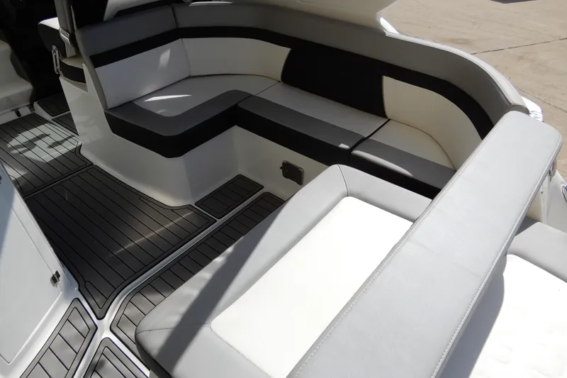 Slide: The Image of 2022 Monterey 295 Sport Yacht interior with sleek seating and modern design. - 14