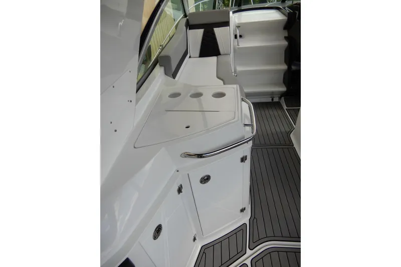 Slide: The Image of 2022 Monterey 295 Sport Yacht interior with sleek white cabinetry and modern design. - 15