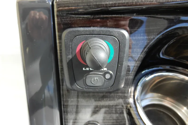 Slide: The Image of Control panel on 2022 Monterey 295 Sport Yacht, featuring a joystick and power button. - 26