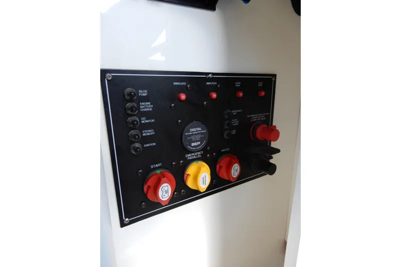 Slide: The Image of Control panel of a 2022 Monterey 295 Sport Yacht with various switches and indicators. - 31