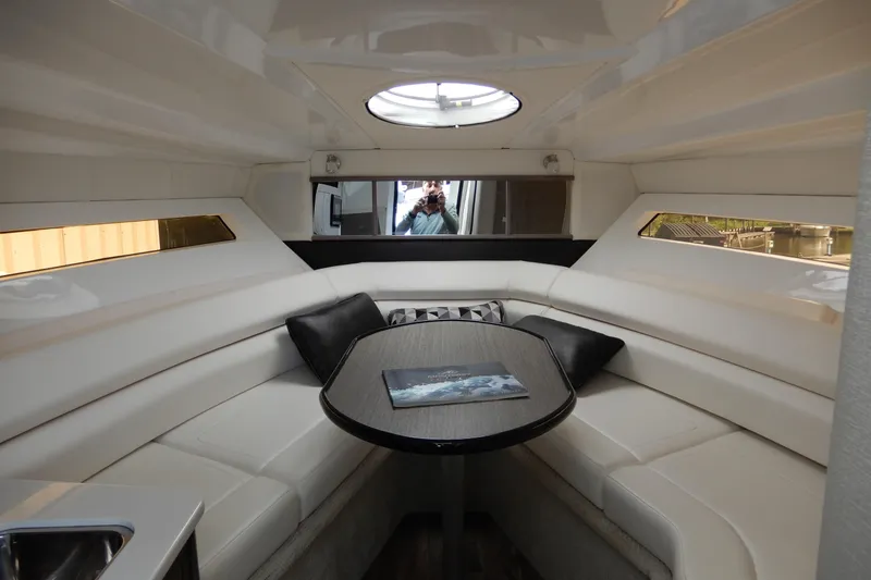 Slide: The Image of Luxurious interior of 2022 Monterey 295 Sport Yacht with elegant seating and table. - 35